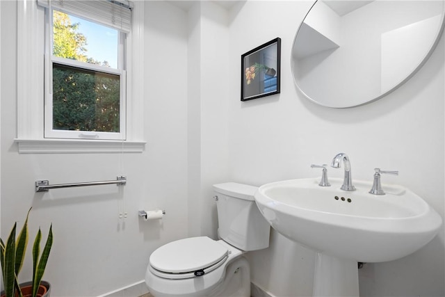 bathroom featuring toilet and sink