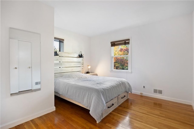 bedroom with hardwood / wood-style flooring