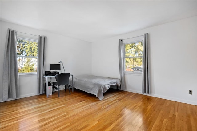 bedroom with light hardwood / wood-style flooring