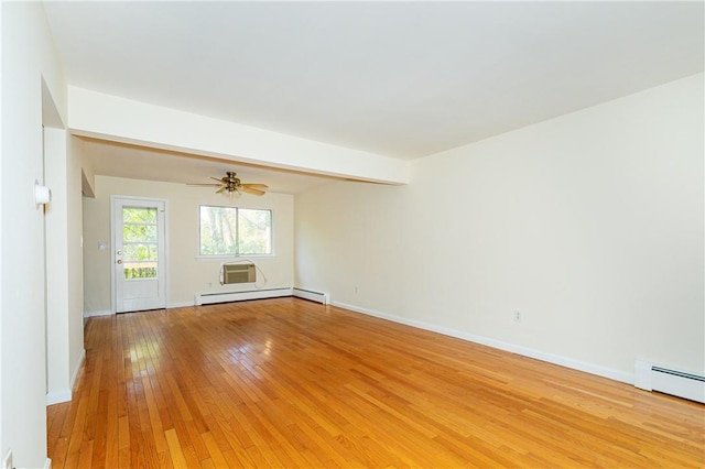 empty room featuring light wood-type flooring, baseboard heating, and ceiling fan