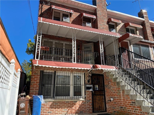 view of front of home with a balcony