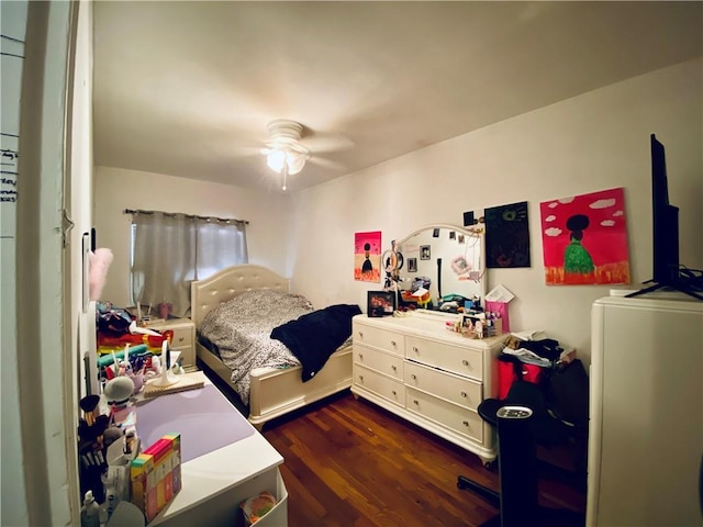 bedroom featuring ceiling fan and dark wood-type flooring