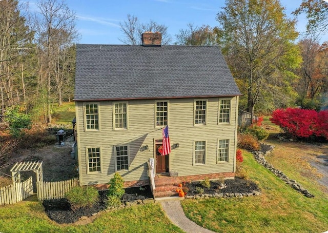 colonial home with a front yard