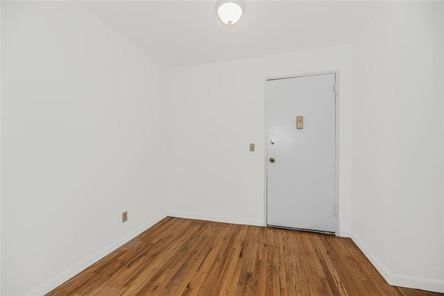 unfurnished room featuring hardwood / wood-style floors