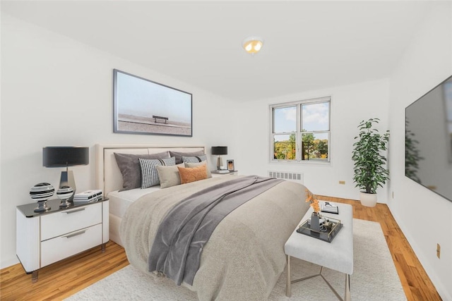 bedroom with light hardwood / wood-style floors