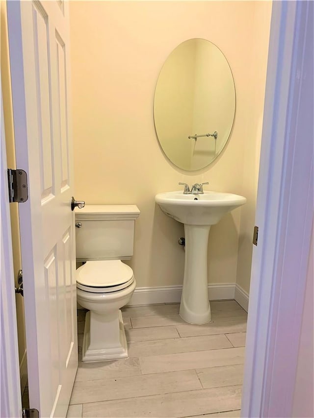 bathroom with toilet and sink