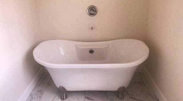 bathroom with a tub to relax in