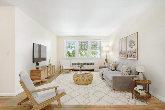 living room with radiator and light wood-type flooring