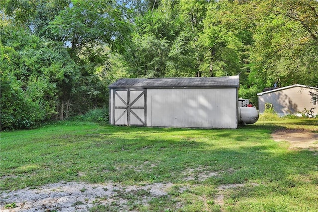 view of outbuilding with a lawn