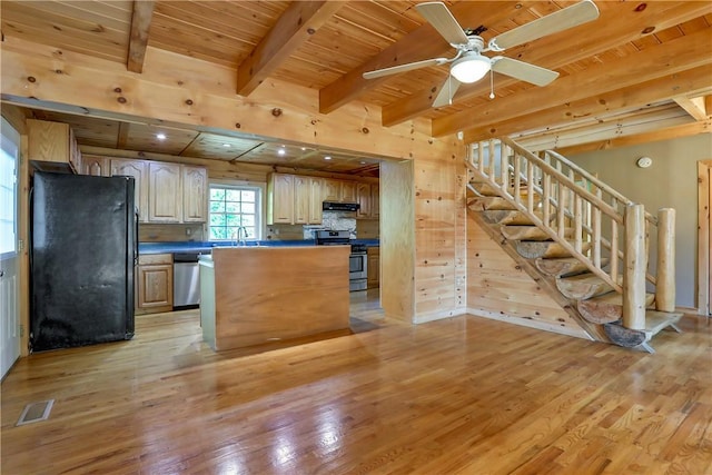 kitchen featuring wood ceiling, beamed ceiling, stainless steel appliances, and light hardwood / wood-style floors