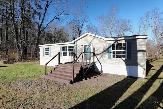 manufactured / mobile home with a front lawn