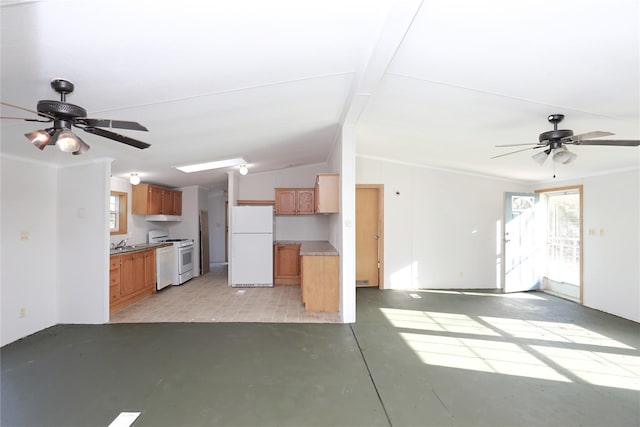 unfurnished living room with ceiling fan, sink, and vaulted ceiling