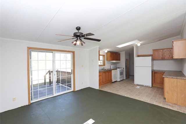 interior space featuring crown molding, ceiling fan, and vaulted ceiling