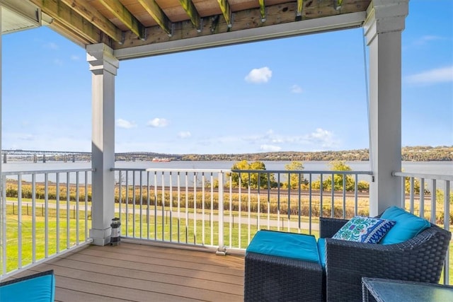 wooden terrace with a water view