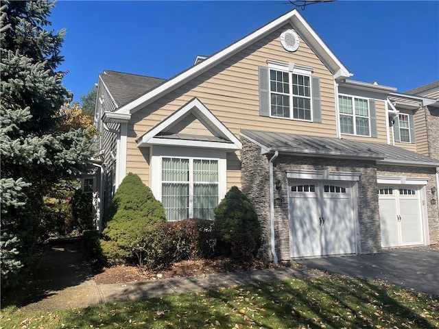 view of property exterior with a garage