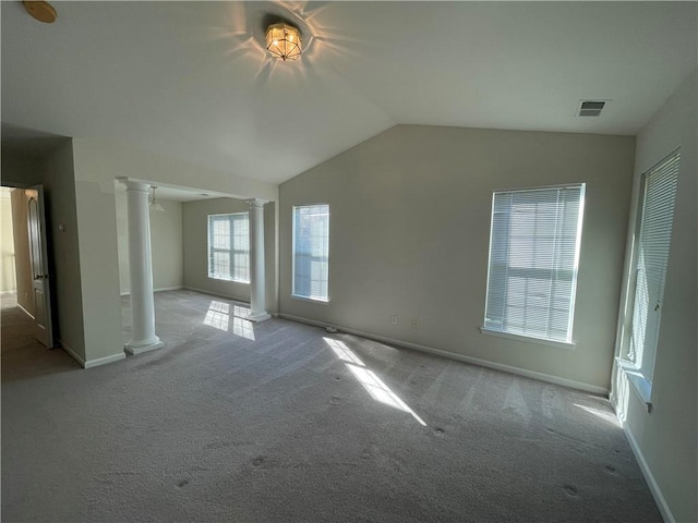 interior space with decorative columns and vaulted ceiling