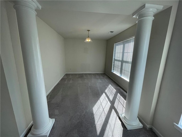 unfurnished dining area featuring dark carpet