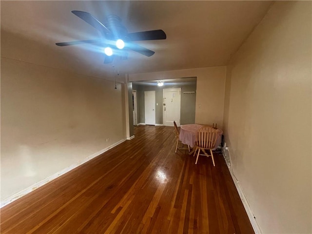 spare room with dark wood-type flooring