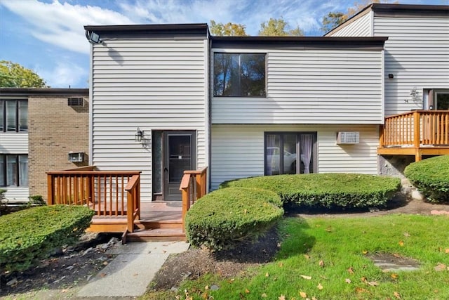 back of house featuring a deck