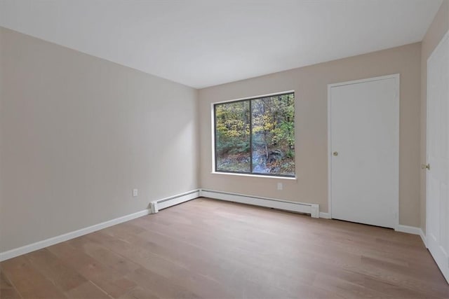 spare room with light hardwood / wood-style floors