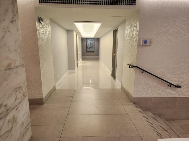 corridor with light tile patterned floors