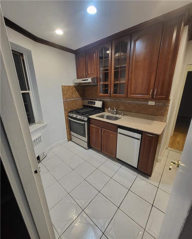 800 Grand Concourse Unit 4G-N, Bronx, NY 10451 - kitchen with stainless steel gas stove, dishwasher, under cabinet range hood, crown molding, and a sink