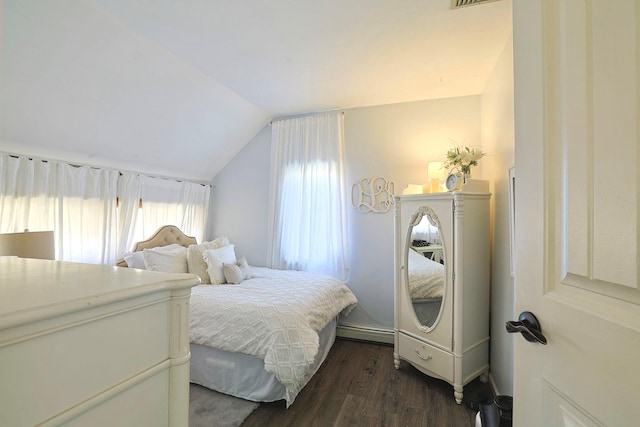 bedroom with lofted ceiling, dark wood-style floors, visible vents, and baseboard heating