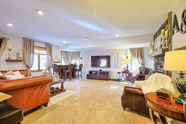 living room with a fireplace and recessed lighting