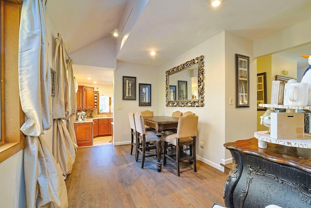 dining room featuring recessed lighting, baseboards, and wood finished floors