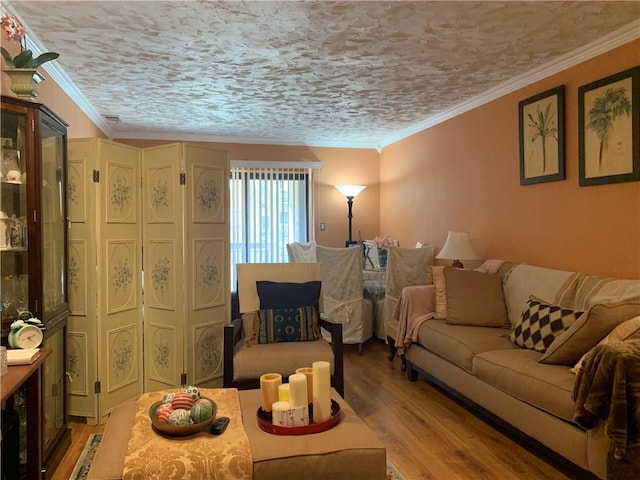 living room featuring crown molding, a textured ceiling, and hardwood / wood-style flooring