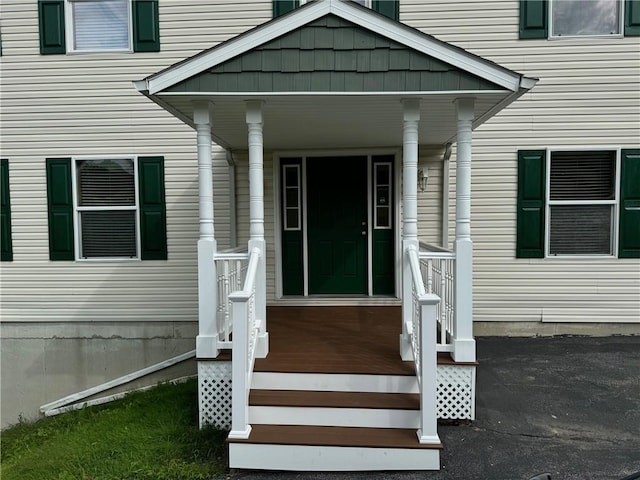 entrance to property with a porch