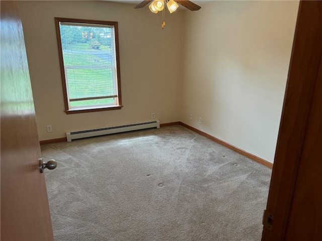 carpeted empty room featuring ceiling fan and a baseboard radiator