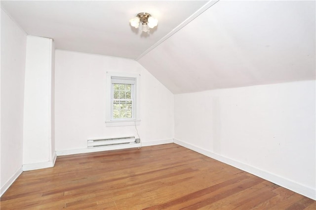 bonus room featuring a baseboard radiator, vaulted ceiling, and wood-type flooring