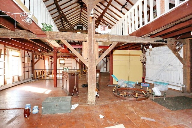 miscellaneous room with lofted ceiling