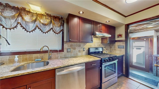 kitchen featuring sink, ornamental molding, light tile patterned floors, light stone counters, and stainless steel appliances