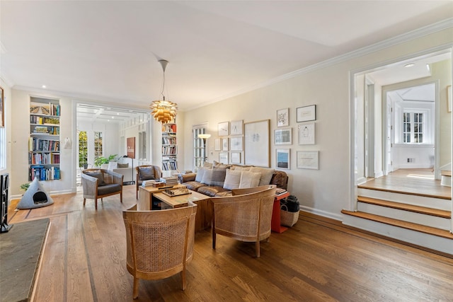 living room with ornamental molding, built in features, and dark hardwood / wood-style flooring