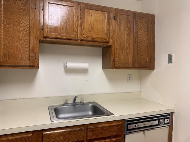 kitchen featuring dishwasher and sink