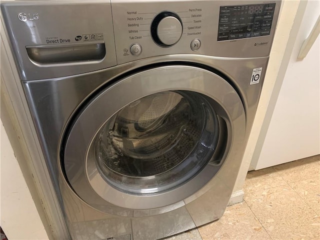 washroom featuring washer / clothes dryer and tile patterned floors