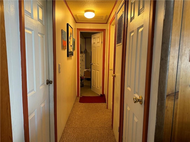 hallway featuring a textured ceiling