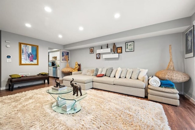 living room with dark hardwood / wood-style flooring