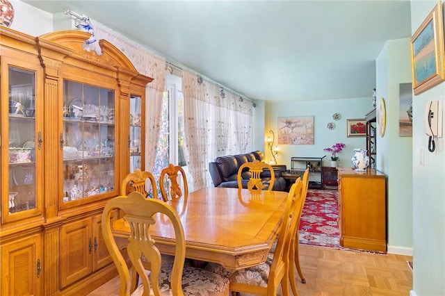 dining area with light parquet flooring