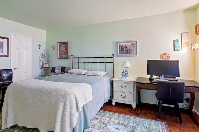 bedroom featuring dark parquet floors