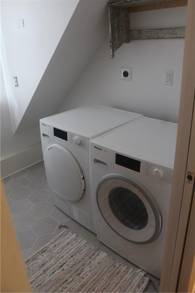 washroom with stacked washer / dryer