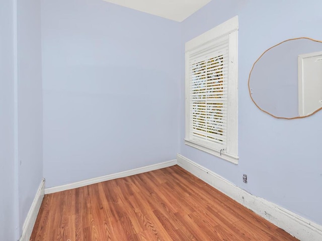 unfurnished room featuring hardwood / wood-style floors