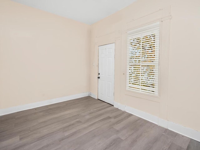 spare room featuring hardwood / wood-style floors