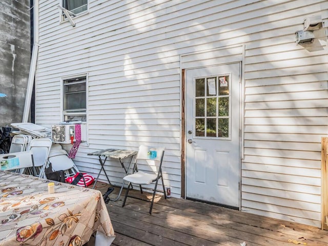 doorway to property featuring a wooden deck