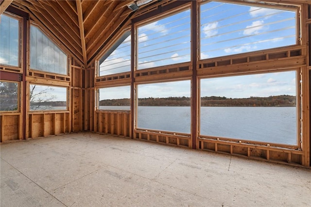 unfurnished sunroom featuring plenty of natural light, a water view, and lofted ceiling