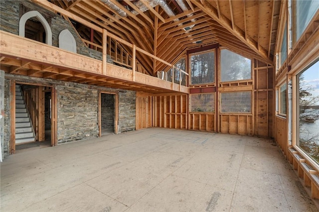 miscellaneous room with high vaulted ceiling