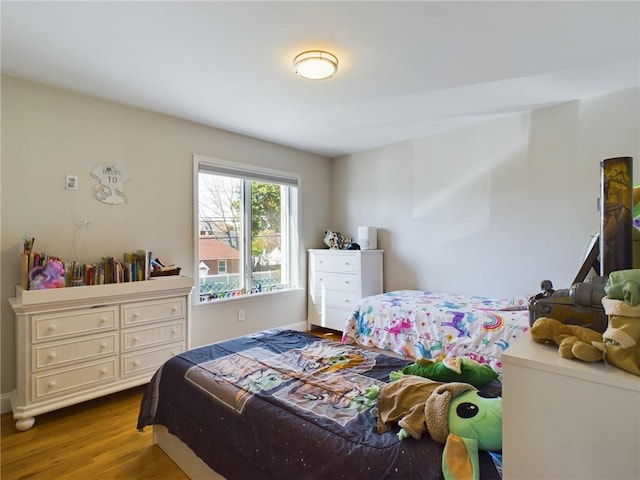 bedroom with wood-type flooring