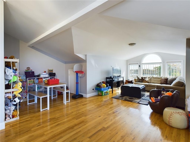 recreation room with lofted ceiling and wood-type flooring